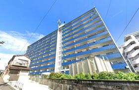 日明コータース