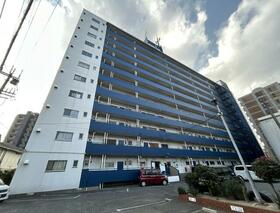 日明コータース