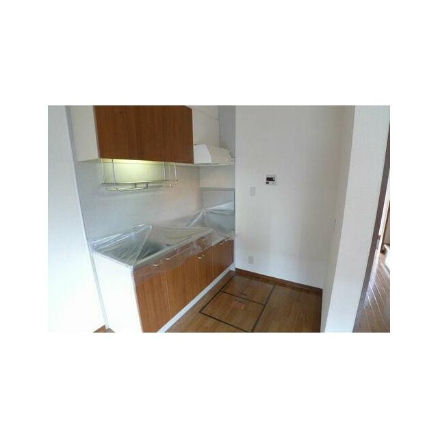 【８．８帖のダイニングキッチン（ＤＫ）】シックな木目調のキッチンです。落ち着いた雰囲気でお料理がで…