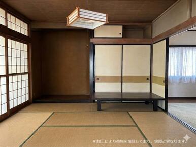 和室と洋室は続き間になっています。※AI加工で荷物を消しておりますので、実際には荷物があります。